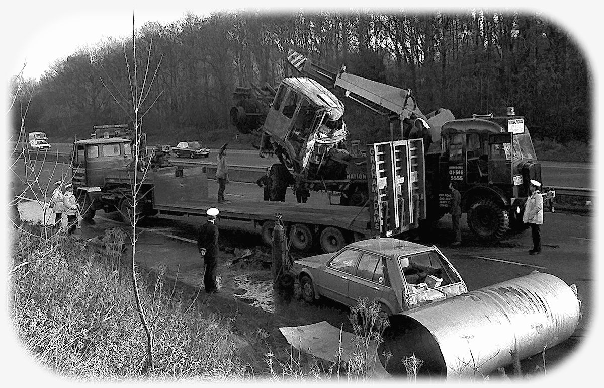 Recovery operators clearing a serious accident on the Esher By-Pass